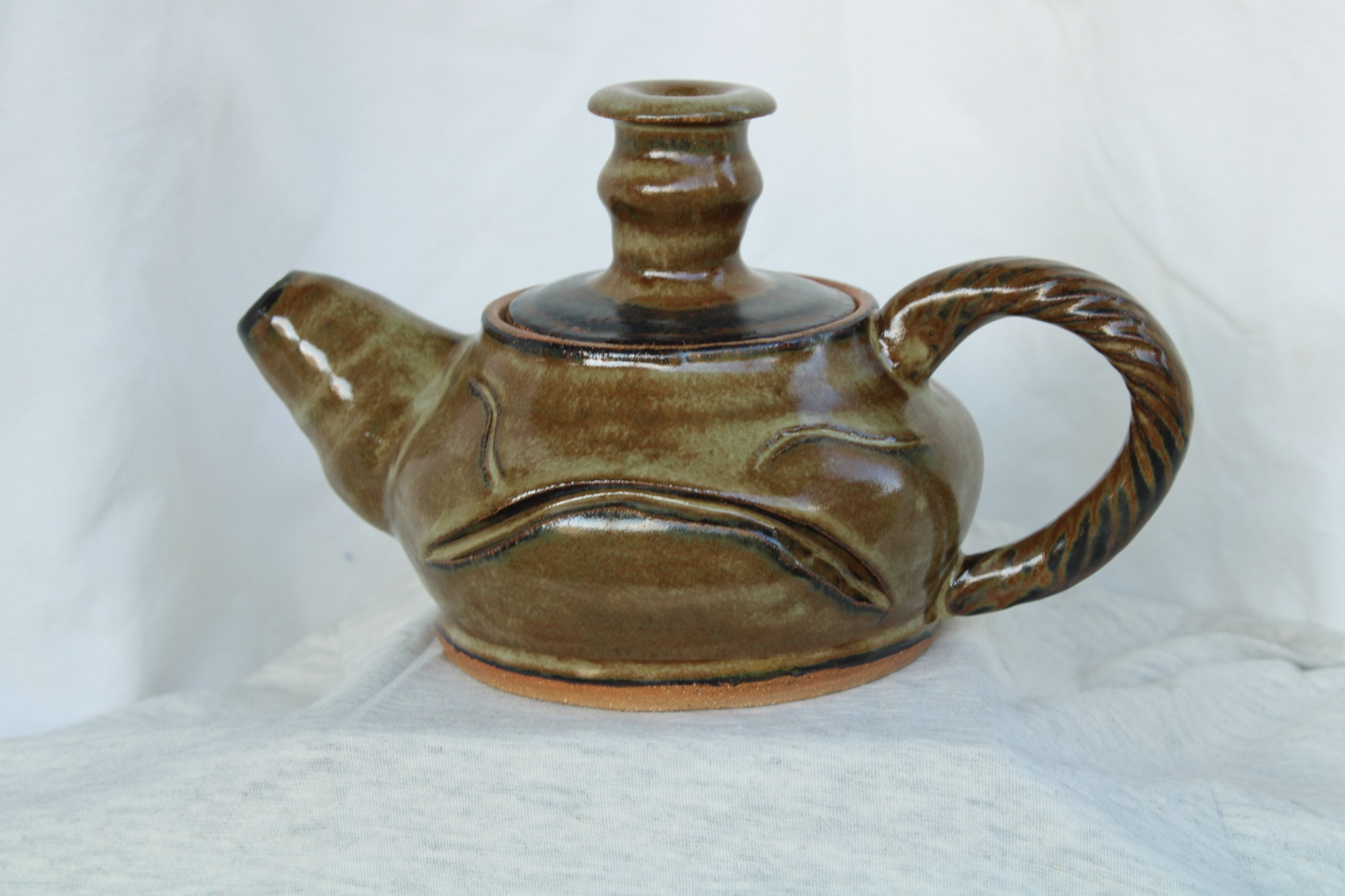 Earth-toned handmade ceramic teapot